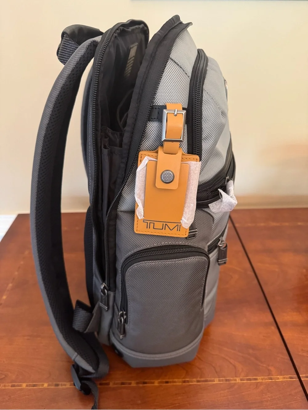 Tumi Gray Parrish Backpack with Black Trim and Tan Leather Tag